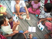 Helen Brunt handing out information packs to local children - photo courtesy of Dr. Elizabeth Wood Helen Brunt handing out information packs to local children - photo courtesy of Dr. Elizabeth Wood