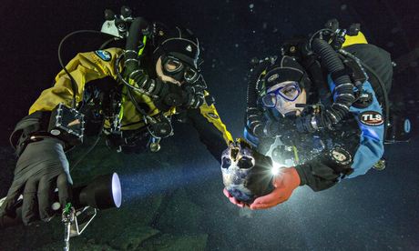 The divers ascending with a 12,000 year old skull