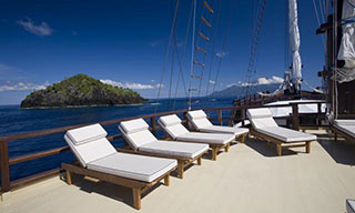 Lay back on Paradise Dancer's deck chairs & soak up the Sulawesi sun