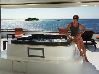 The sun deck's Jacuzzi on Carpe Vita Explorer is a great place to lay back and watch the beautiful unfolding panoramas of the Maldives Islands