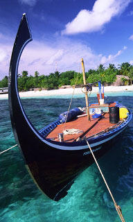 Traditional-style longtail boat, Indian Ocean - photo courtesy of ScubaZoo