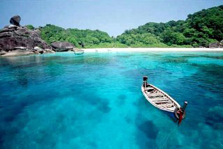 Long-tail boat at Donald Duck Bay, Similan Island no. 8 - photo courtesy of Tourist Authority of Thailand