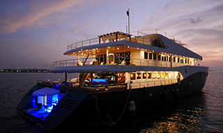 The floating palace twinkles on the sea at night