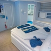 The spacious Premium cabin with TV, ample storage