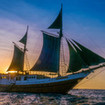 The SMY Ondina liveaboard, basks in the golden Indonesian sunset