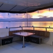 Outdoor lounge area at the stern of the main deck